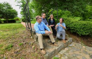 Land planning and recreation team sitting on steps