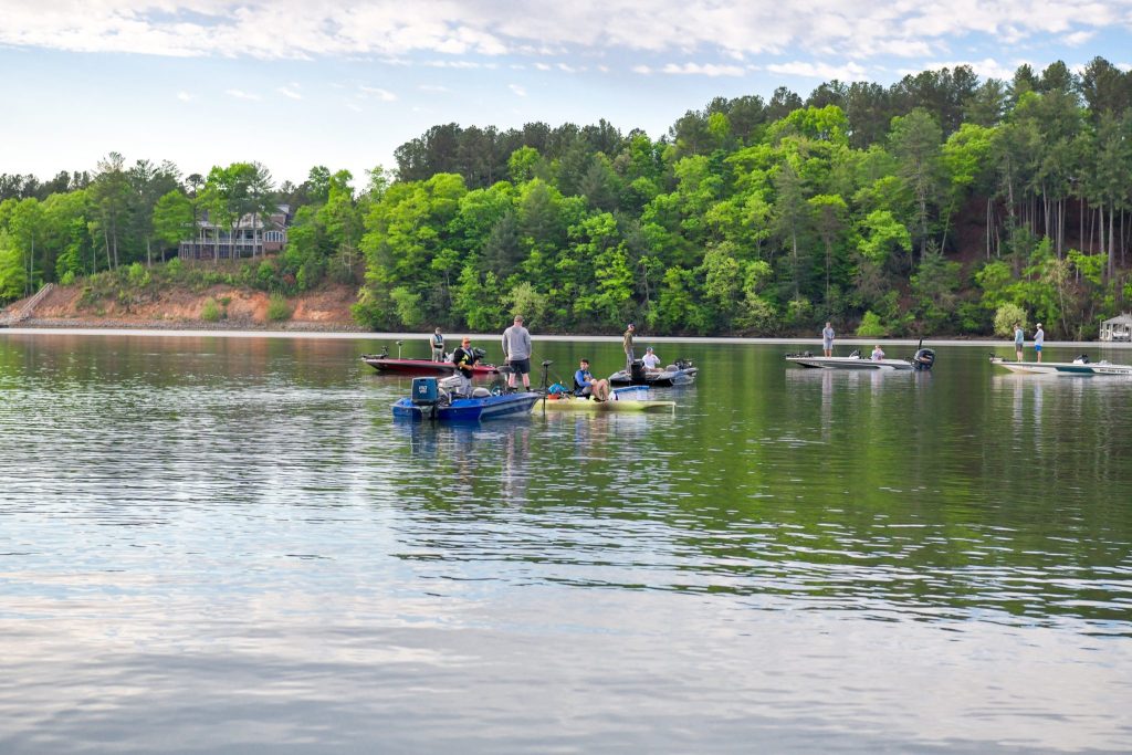 boaters in the water fishing