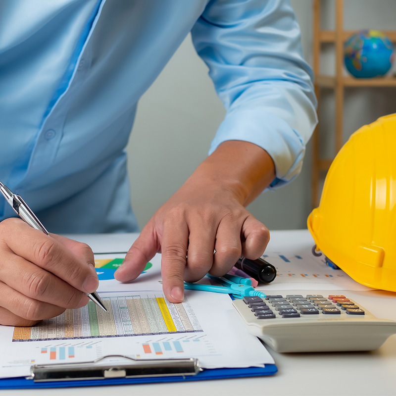 Engineer conducting calculations to determine the technical components of a merger and regionalization study